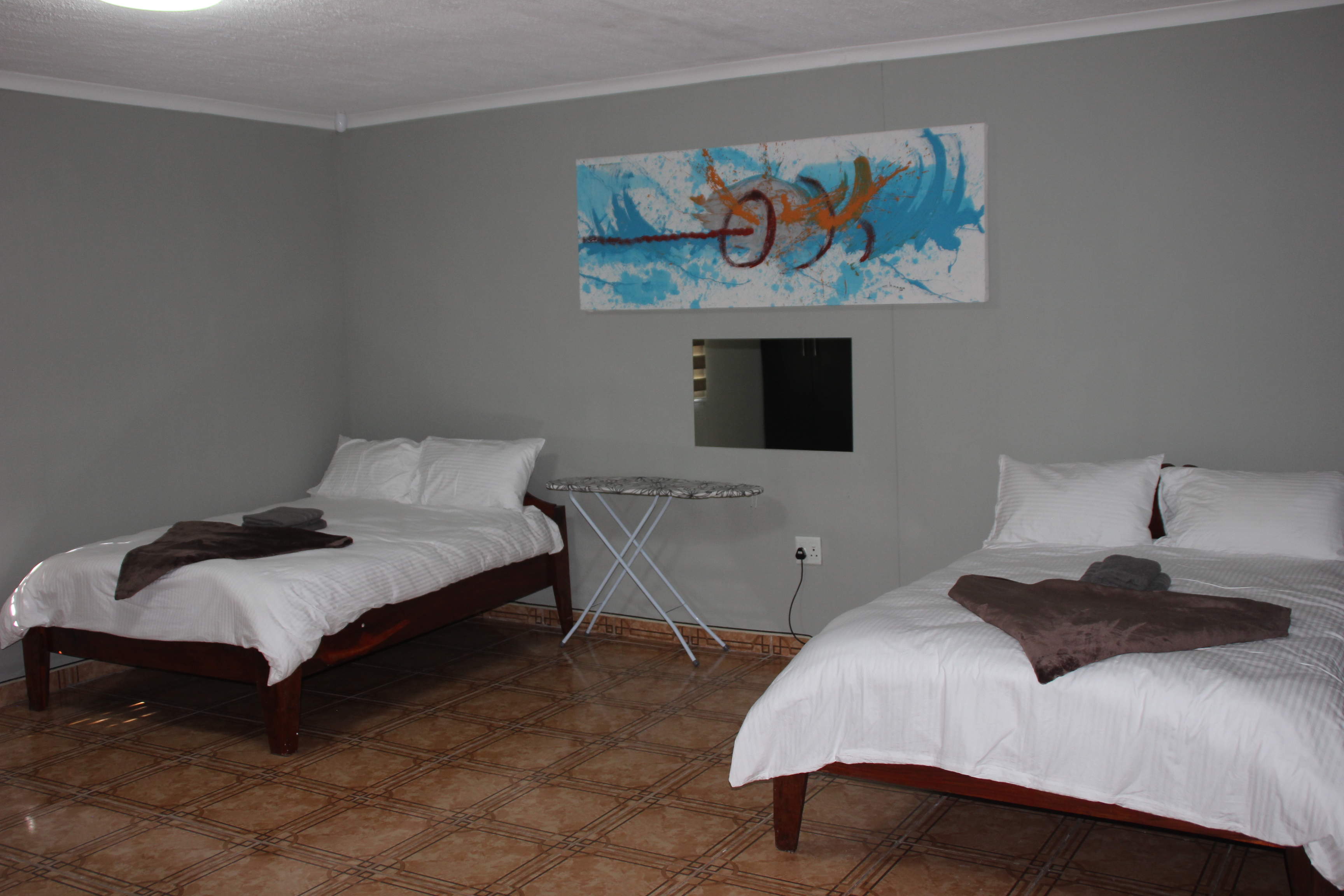 Spacious self-catering room with kitchenette at Zambali Lodge